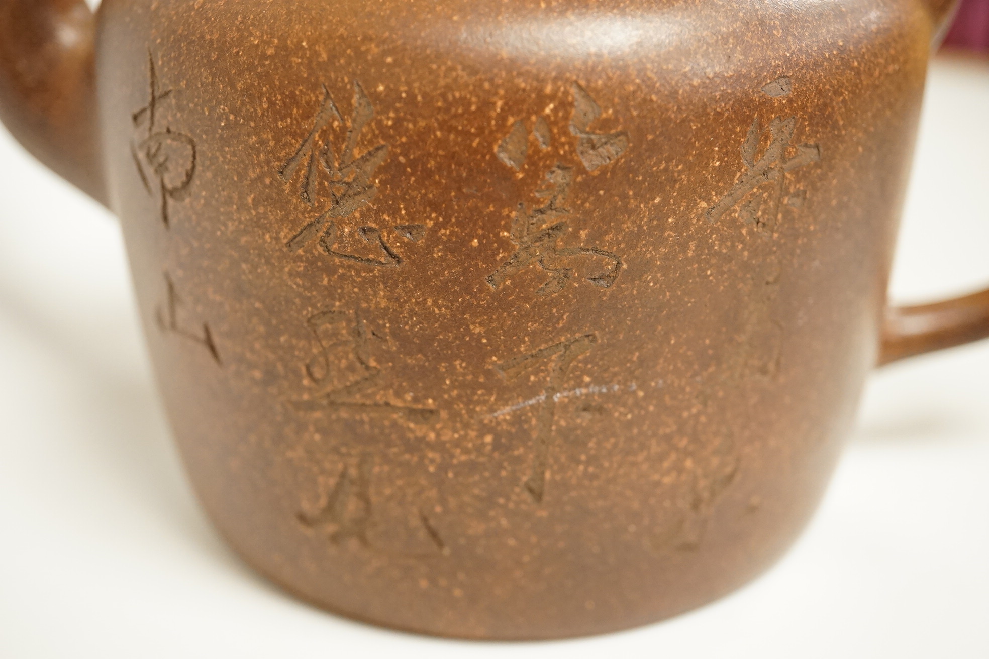 A cased set of semi-precious handled butter knives, two Chinese pottery teapots, a stoneware box and a figure, etc.